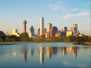 Skyline of Dallas City, Texas, USA. The photo depicts the city's skyline reflected on water.