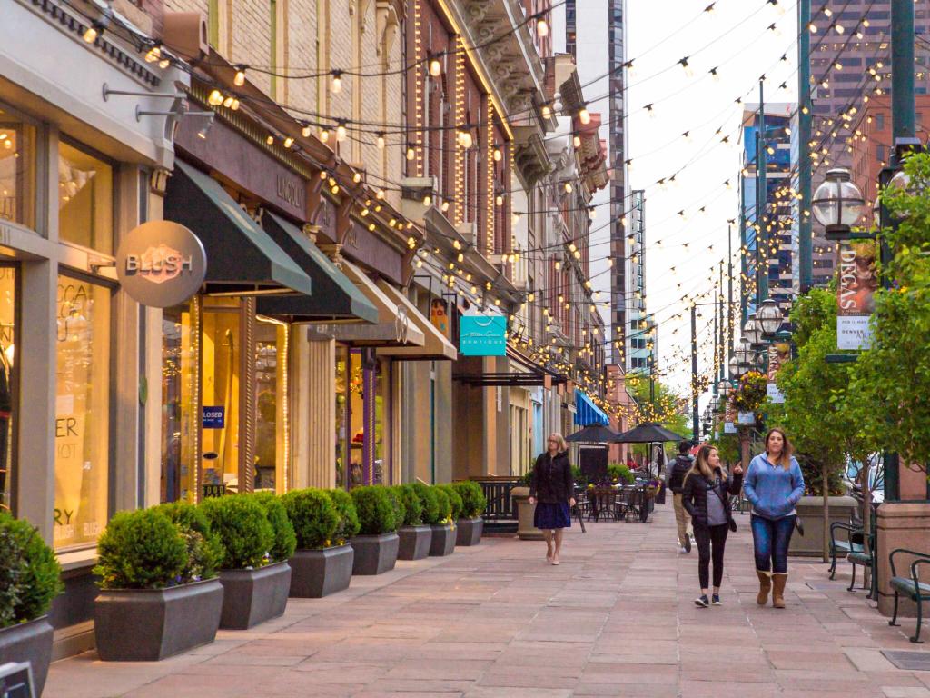 Street scene along historic Larimer Square in downtown Denver with restaurants and shops in view.