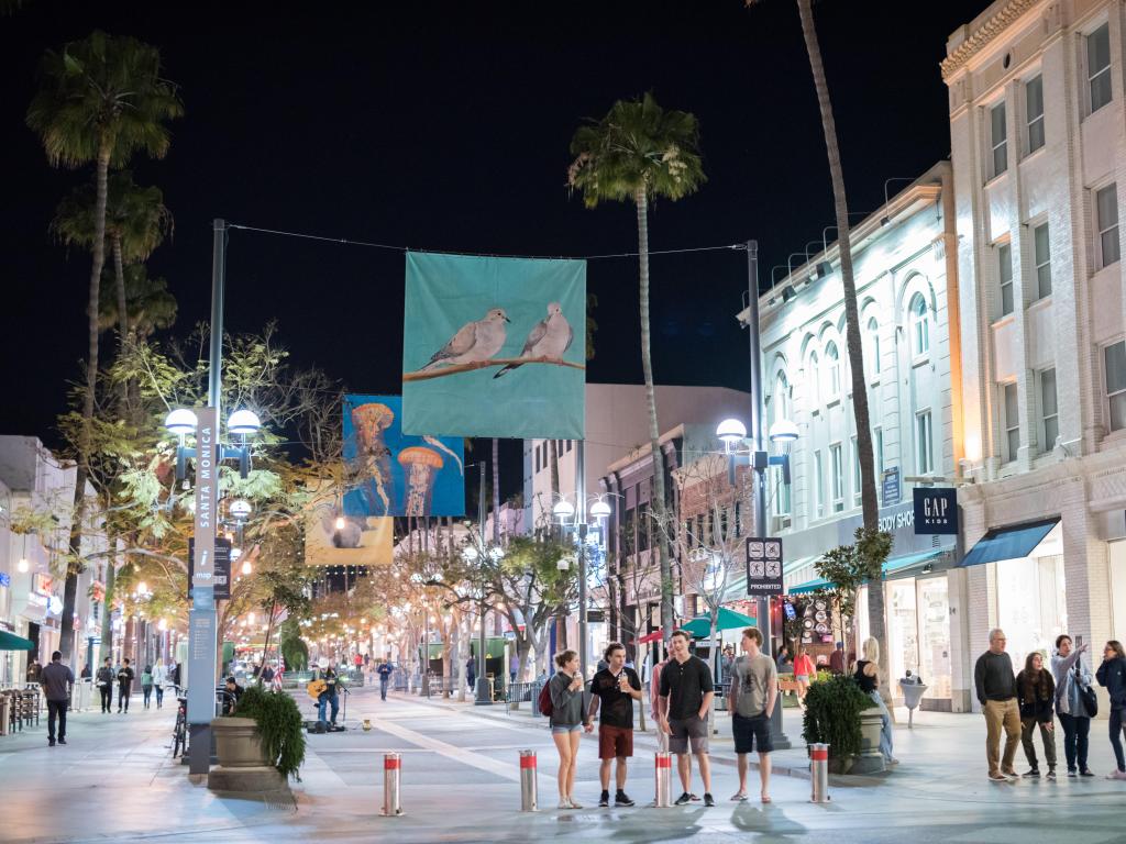 People walking along the shops and restaurants of Third Street Promenade at night, Santa Monica, Los Angeles
