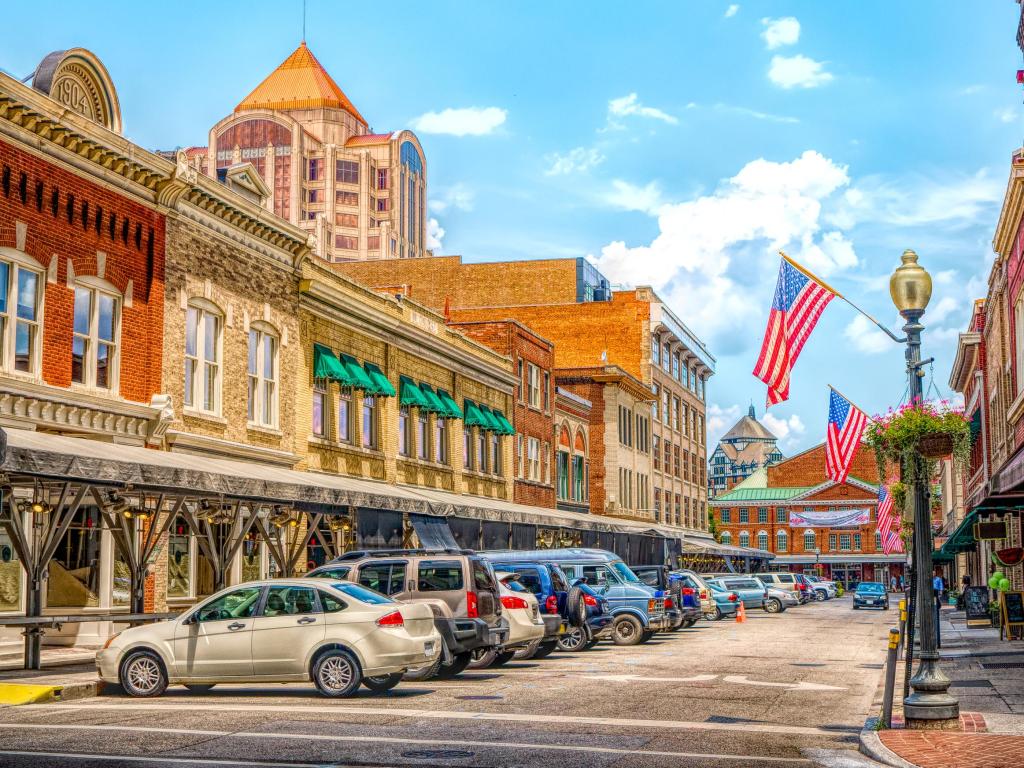 Small Town quaint USA main street hometown commercial storefront shops with flag in downtown Roanoke Virginia