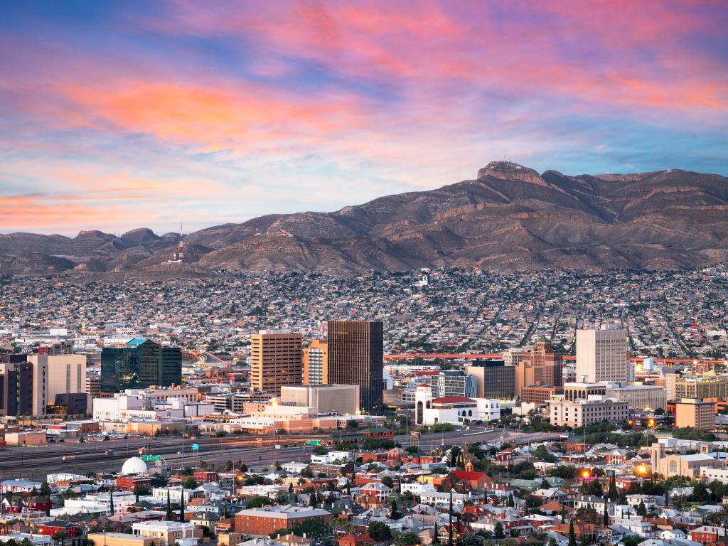 El Paso, Texas, USA downtown city skyline at dusk with Juarez, Mexico in the distance.