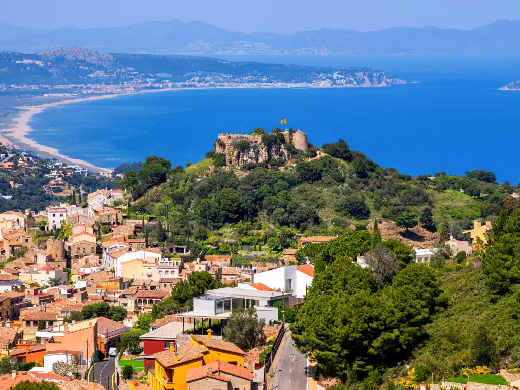 Begur Old Town and Castle overlooking Mediterranean Sea and the Pyrenees mountains