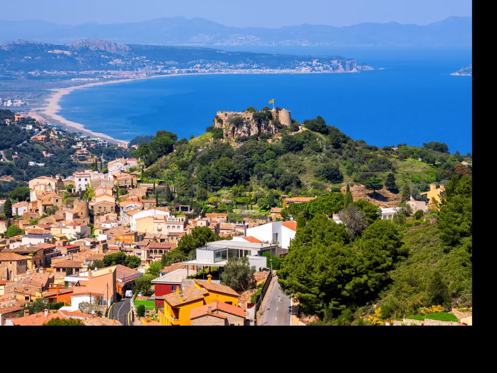 Begur Old Town and Castle overlooking Mediterranean Sea and the Pyrenees mountains