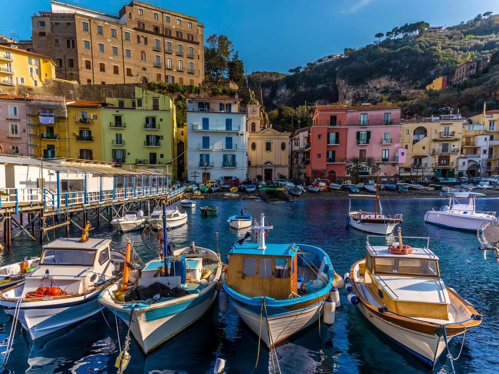 A view looking back over fishing boats of the Marina Grande, Sorrento, Italy