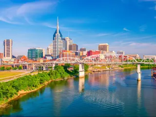 Nashville, Tennessee, USA downtown city skyline on the Cumberland River.