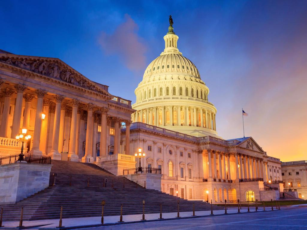 Washington DC, USA taken at the United States Capitol building with the dome lit up at night.