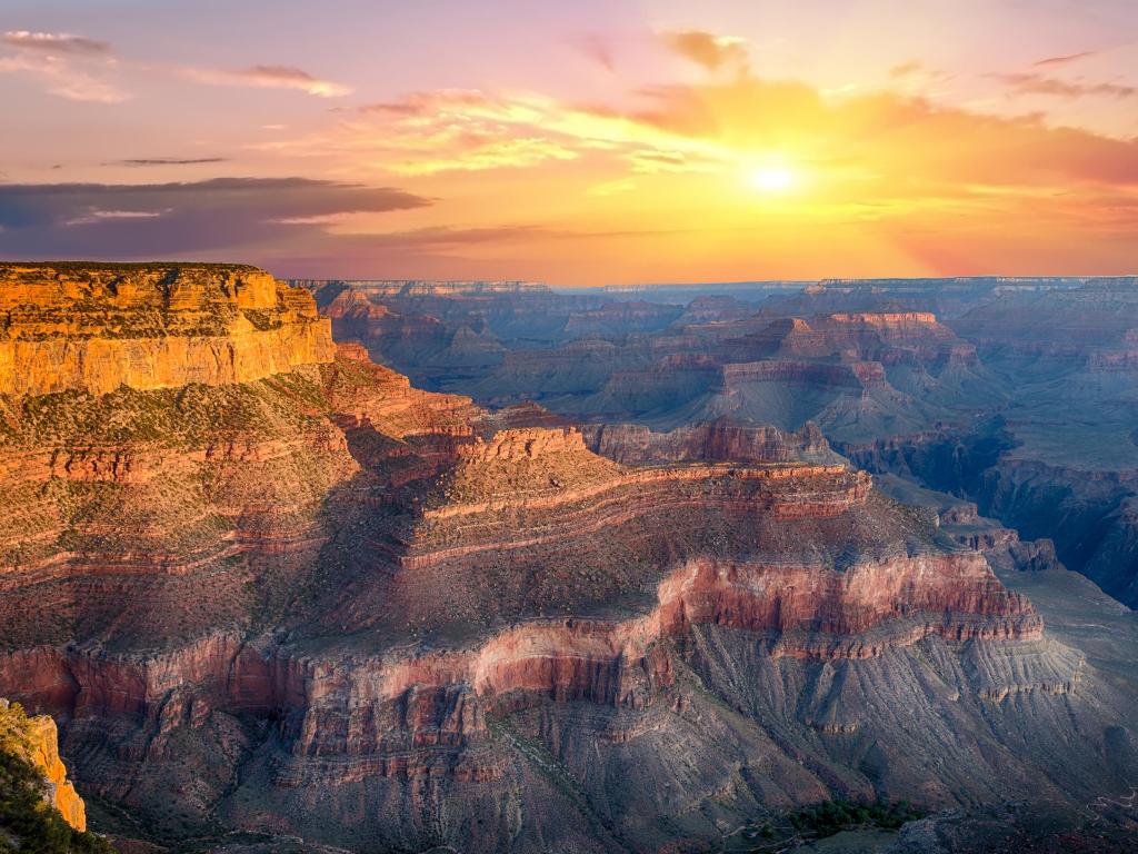 Grand Canyon, Arizona, USA with beautiful colors in the sky at sunset and shapes of the canyon taken at Yavapai Point. 