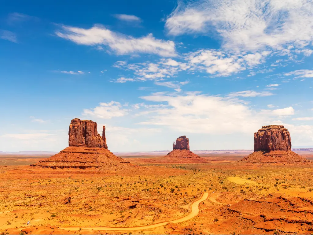 Breathtaking view on the West Mitten, East Mitten and Merrick Buttes in Monument Valley, USA against a blue sky.