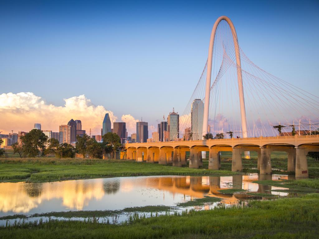 Margaret Hunt Hill Bridge and the city's skyline reflecting on the river