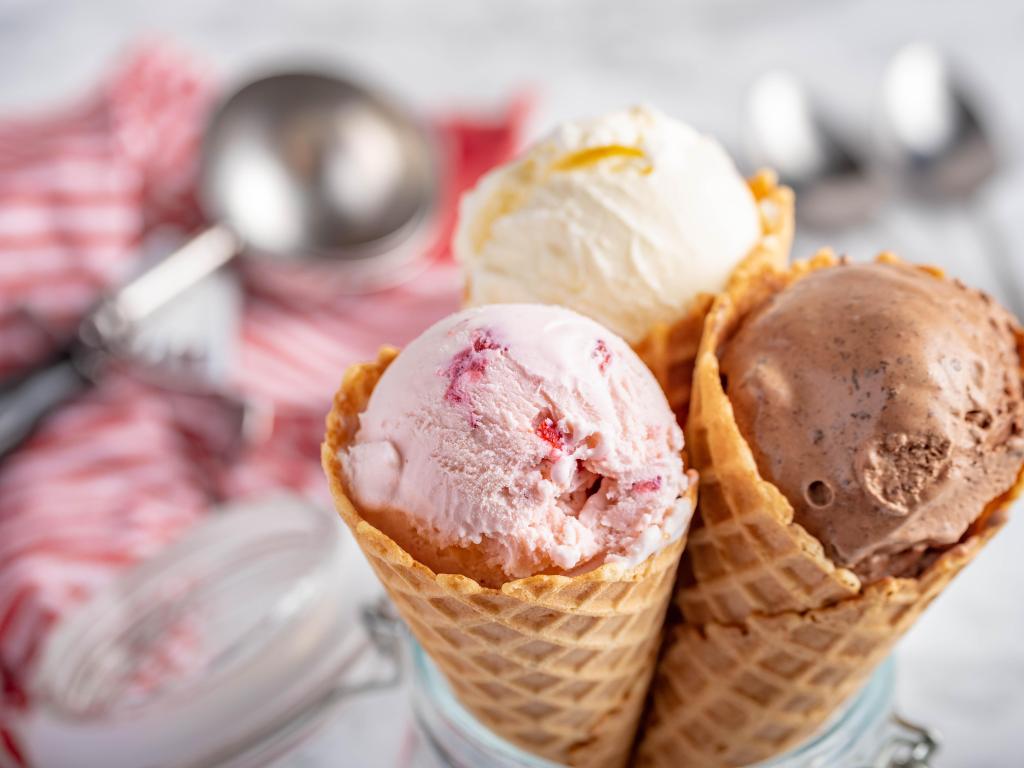 Strawberry, vanilla, chocolate ice cream with waffle cones with marble stone backgrounds