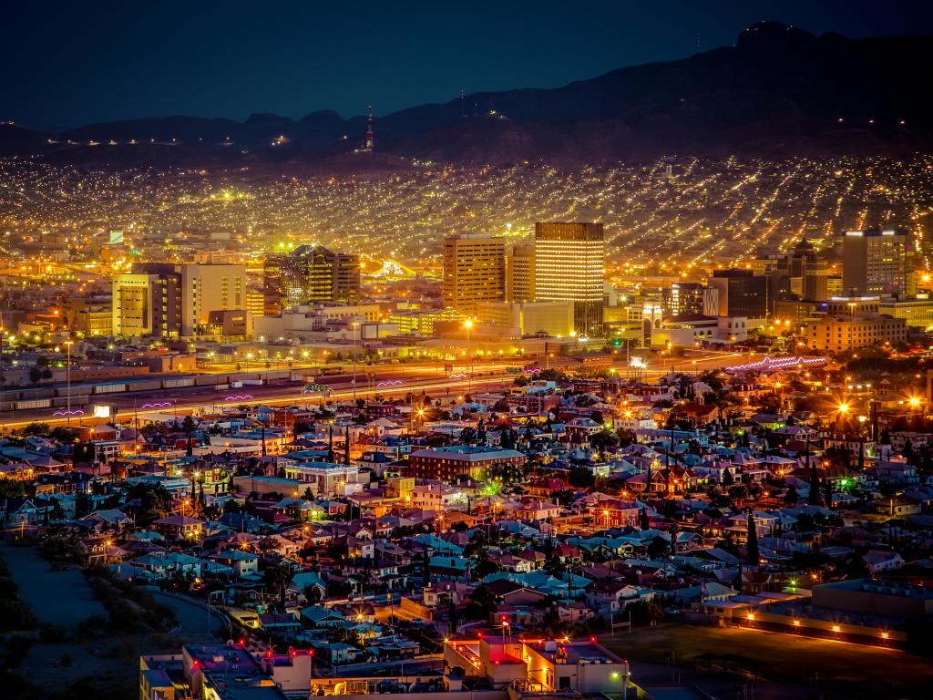 Lights of El Paso city after dark, with mountain in the background