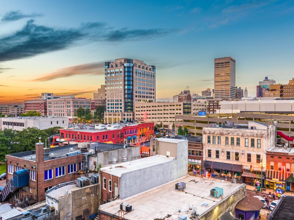 Memphis, Tennessee, USA downtown city skyline over Beale Street after sunset.