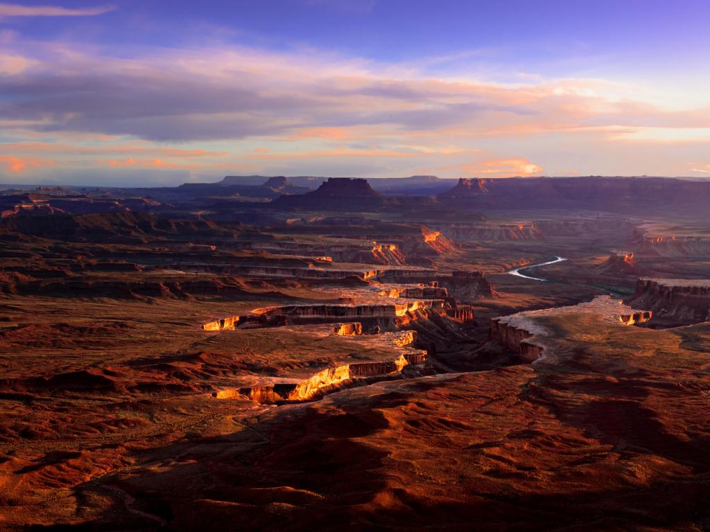 Wide flat rocky plateau with deep canyon and river running through it