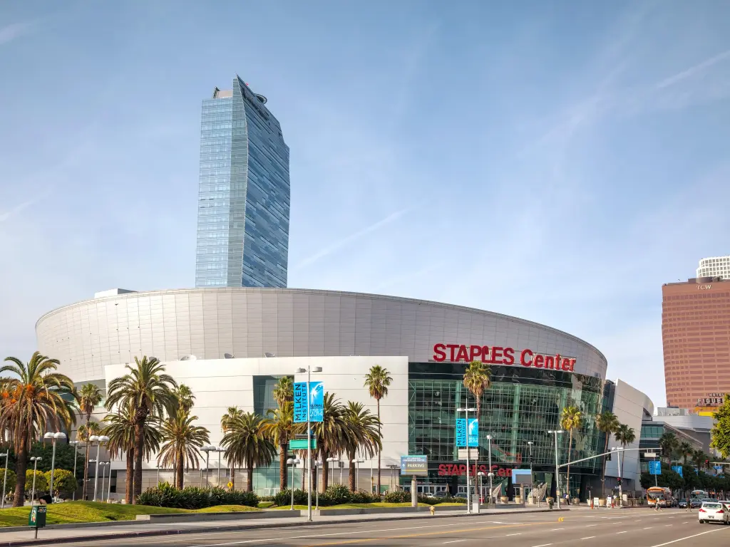 View of the Staples Center in L.A. with palm trees and clear sky