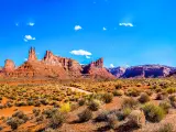 Red rock canyon desert in Nevada panoramic landscape against a blue sky.