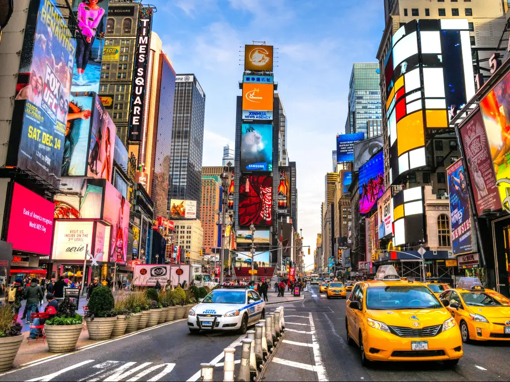 Times Square, a busy tourist intersection of neon art and commerce and is an iconic street of New York City