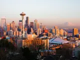 Seattle skyline during sunset with Space Needle in view and mountain in the background