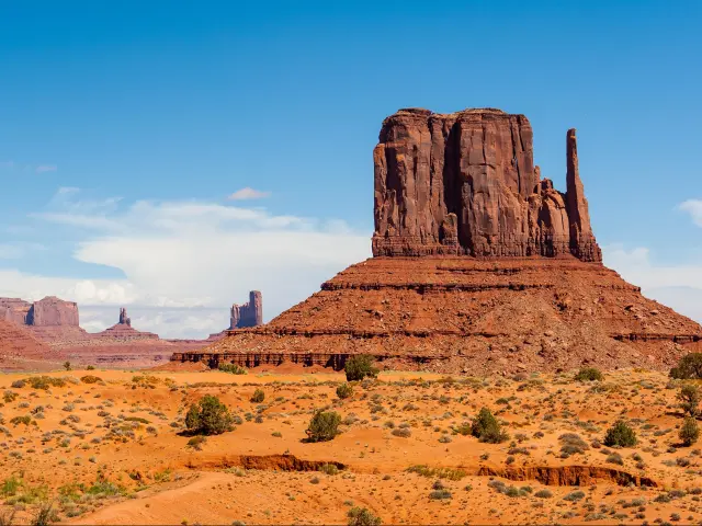 Magnificent red rock formations in Monument Valley under the blue sky.
