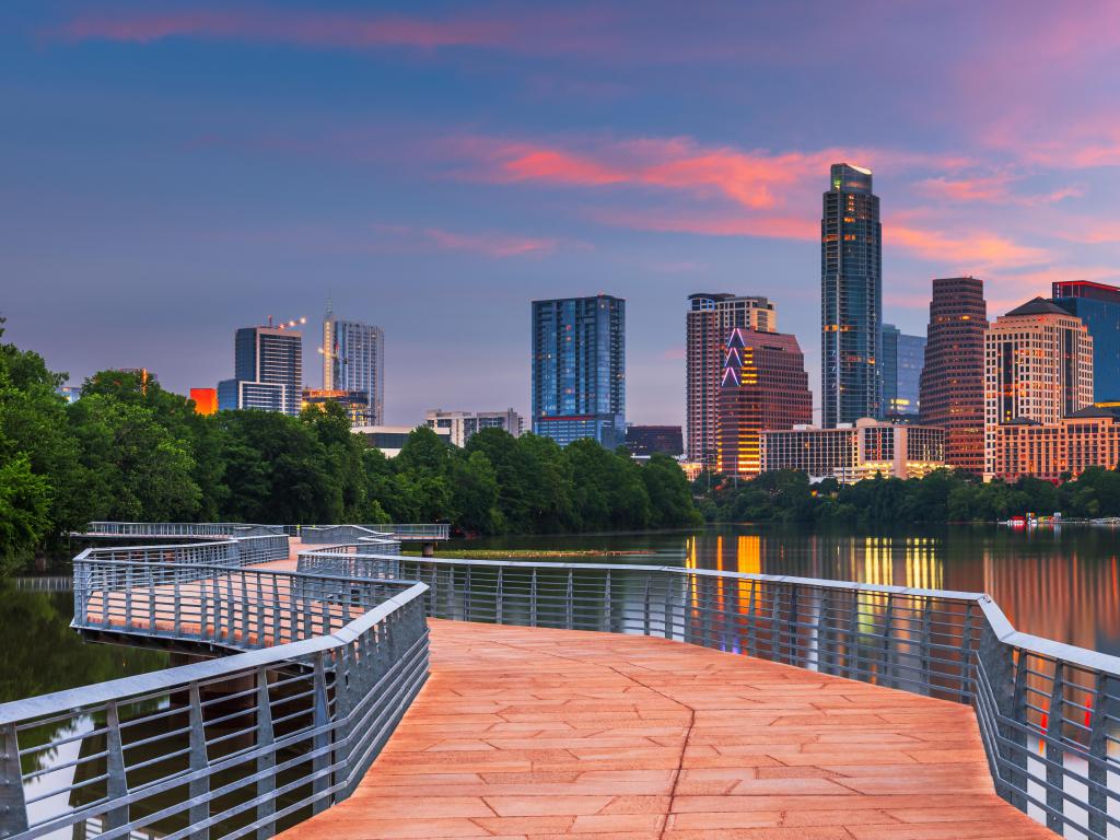 Austin, Texas, USA downtown skyline over the Colorado River at dawn.