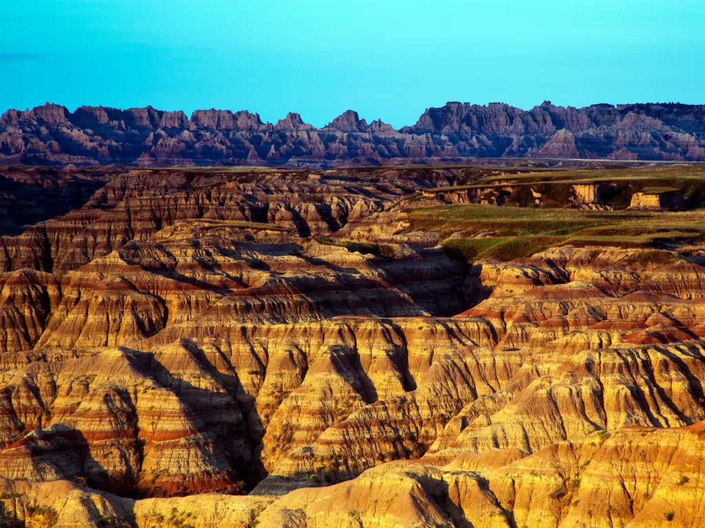 View of the colored rock formations from the overlook in Badlands National Park on a sunny day