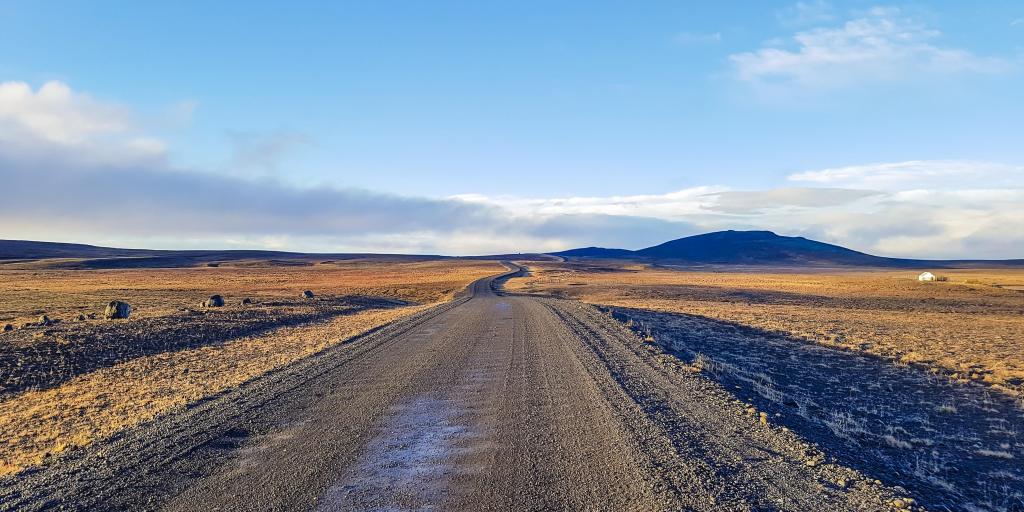 F35 road winding across the land with mountains in the distance in Iceland 