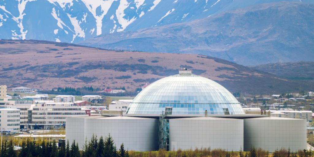 Perlan, Reykjavik with snowy mountains in the background 