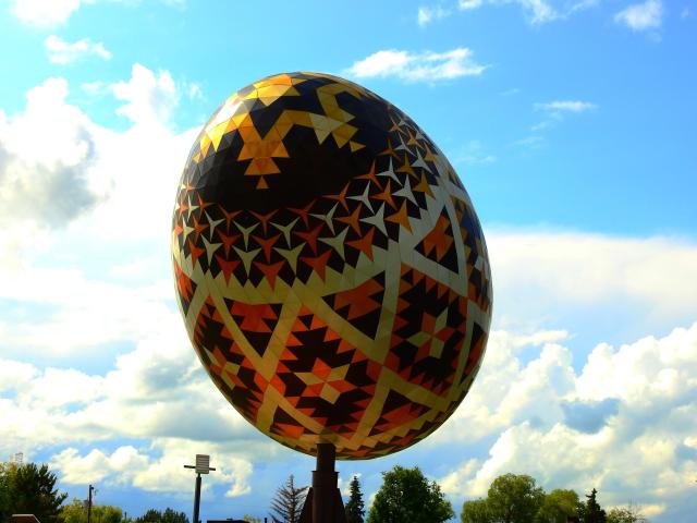Giant sculpture of a pysanka, a painted egg, on a sunny day