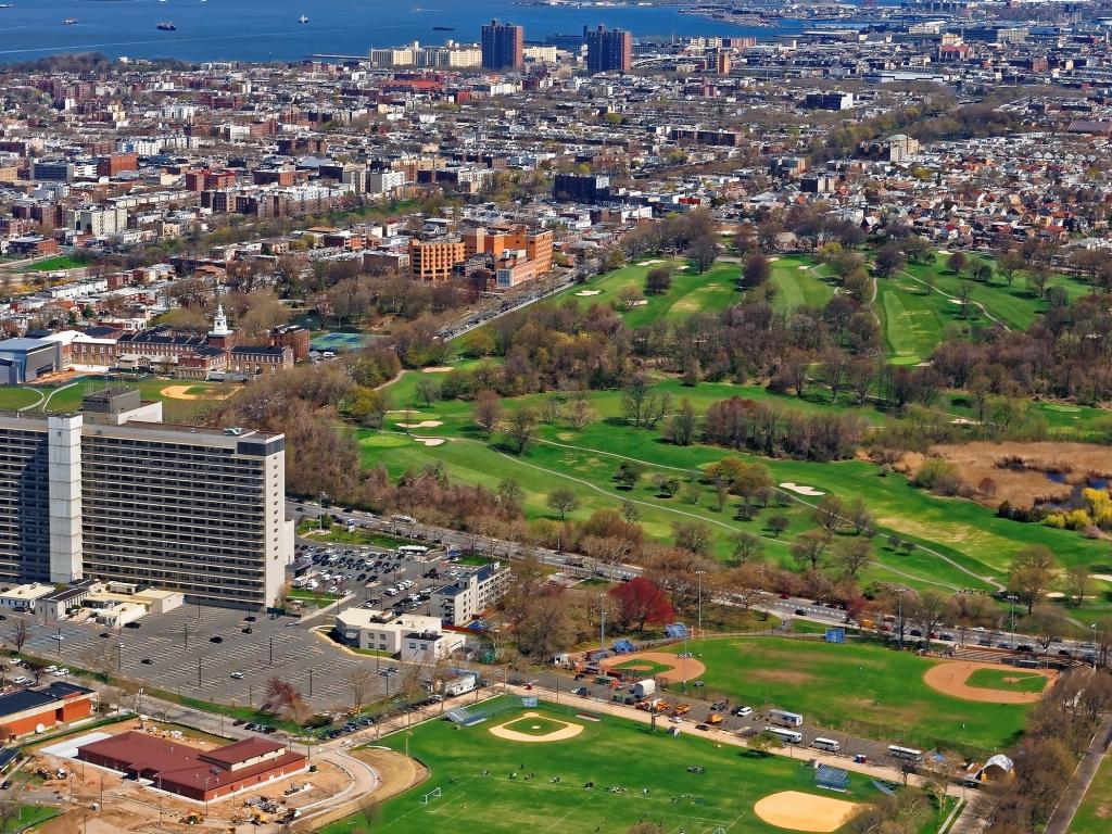 Aerial view of Prospect Park in Brooklyn with downtown Manhattan in the background.