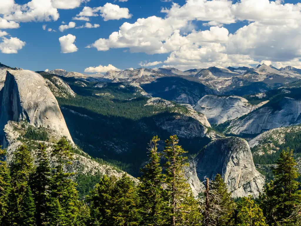A panoramic view of the granite dome in Yosemite Half Dome in Yosemite National Park on a cloudy day.
