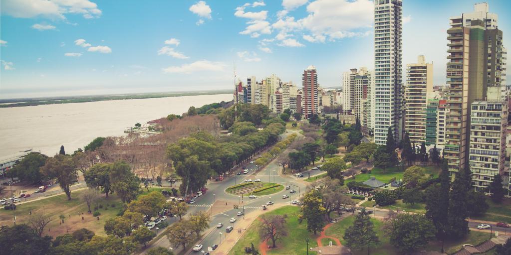 panoramic view cityscape of the city of Rosario, Argentina with the water on one side and high rise buildings on the other. 