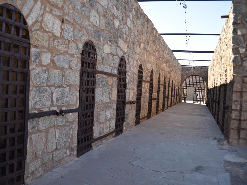 A corridor with inmates' rooms lined up 