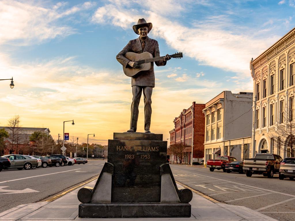 Statue of Hank Williams on Commerce Street in Montgomery with historic buildings either side
