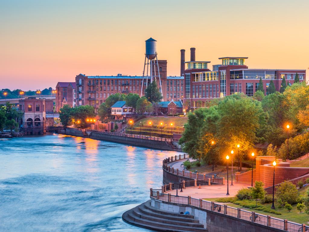 Tall brick building and Riverfront walkway with water tower