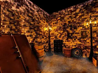 Inside dungeon style themed room with smoke effects, within Escape Room Palm Springs