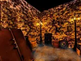 Inside dungeon style themed room with smoke effects, within Escape Room Palm Springs