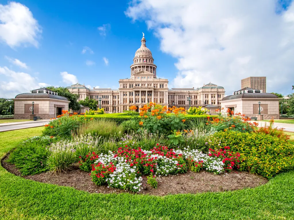 The Texas State Capitol with flower garden