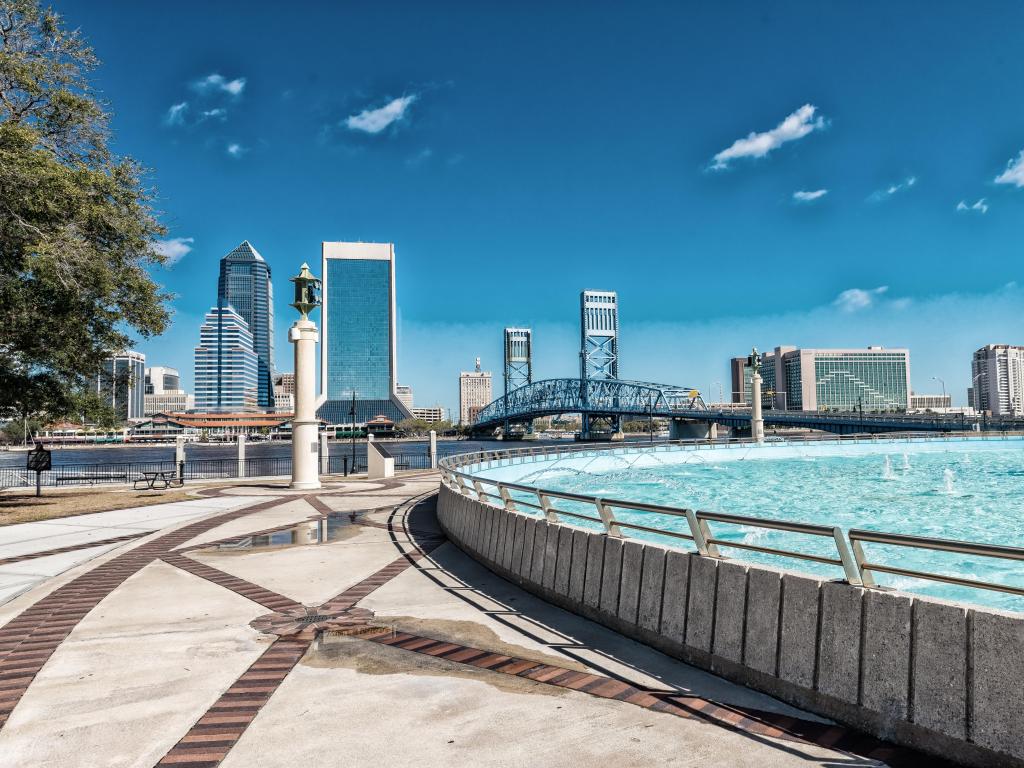 Jacksonville, Florida, USA with the city skyline in the background and a beautiful fountain in the foreground, taken on a sunny clear day. 