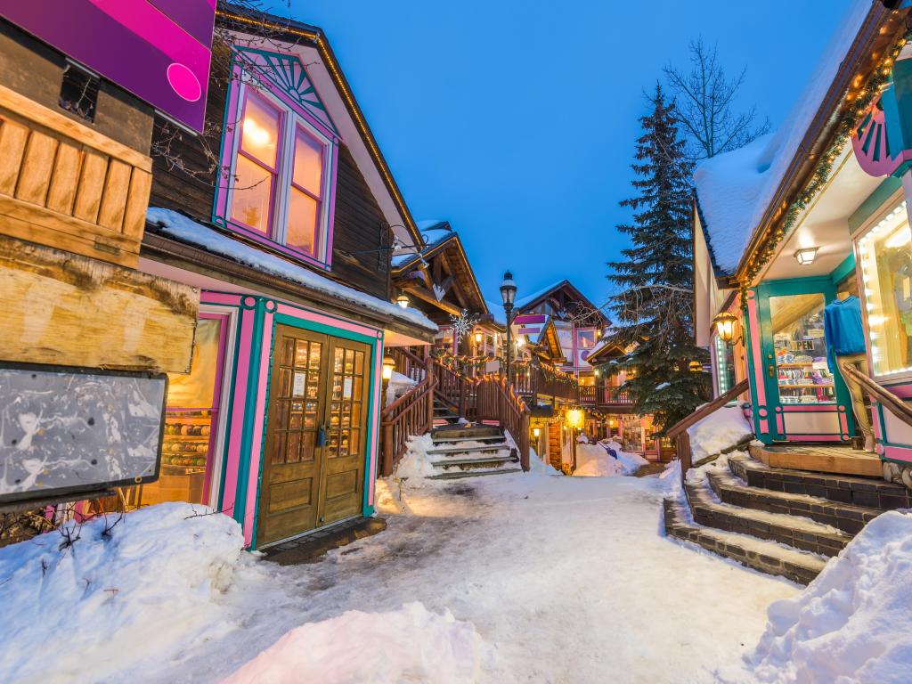 Breckenridge, Colorado, USA downtown streets at night in the winter with holiday lighting.