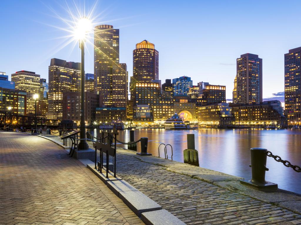 Boston in Massachusetts, USA at sunset showcasing its mix of modern and historic building at Boston Harbor in the Financial District.