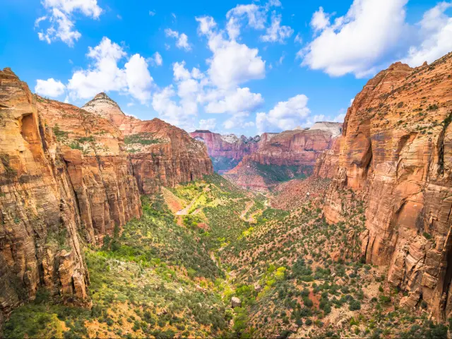 Beautiful view of Zion Canyon National Park from a high scenic overlook on a sunny day with blue skies