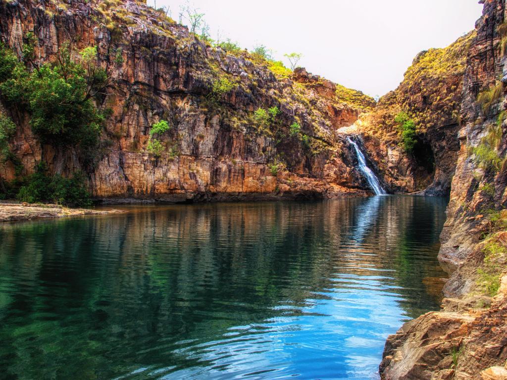 Kakadu National Park, Northern Territory, Australia taken at Maguk (Barramundi Gorge) - a popular swimming hole in Kakadu National Park with a waterfall and water surrounded by tall cliffs.