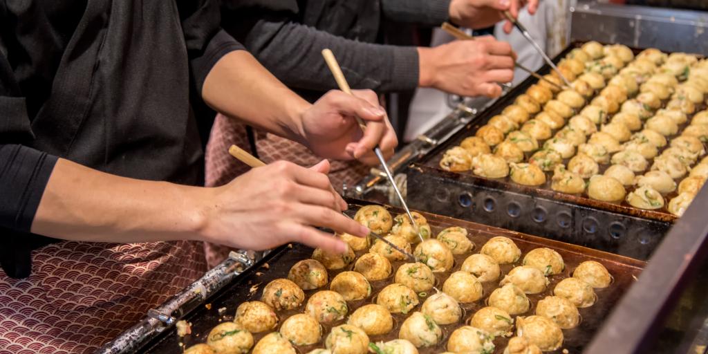 Chefs making takoyaki in Osaka 