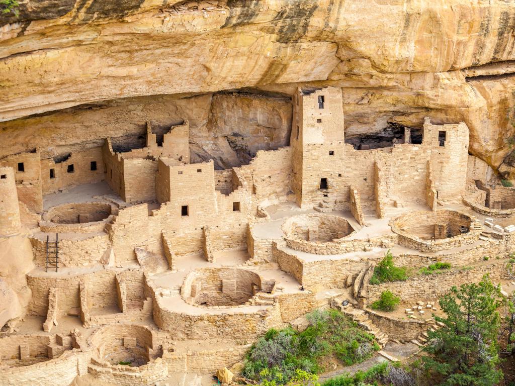 Sandy cliff dwellings nestled within the rockfaces at Mesa Verde National Park