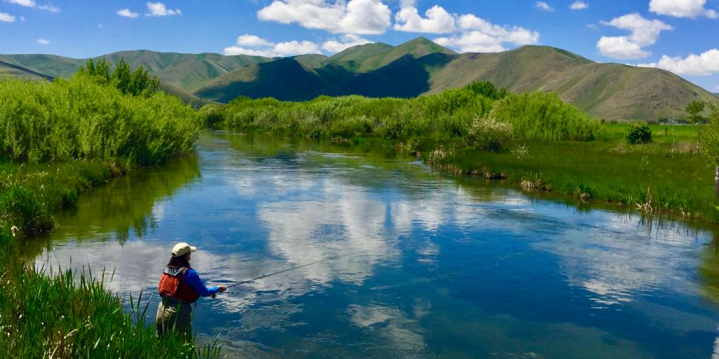 Woman fishing in a creek near Sun Valley, Idaho