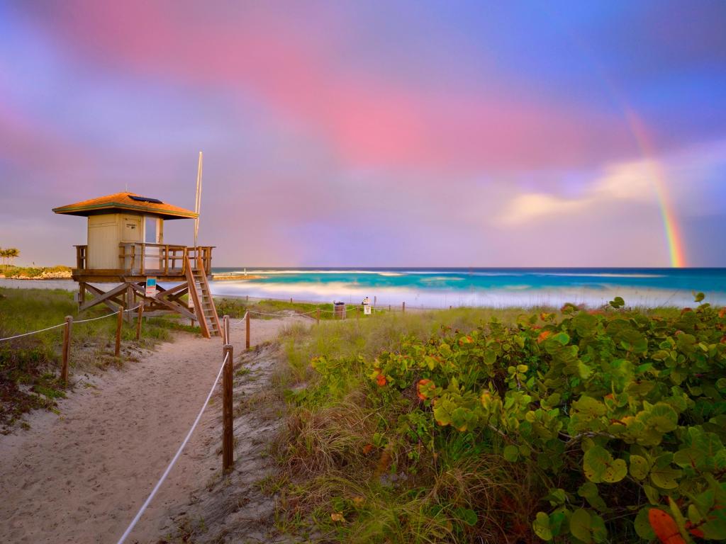 Beautiful Sunset with rainbow at Boca Raton beach, Florida