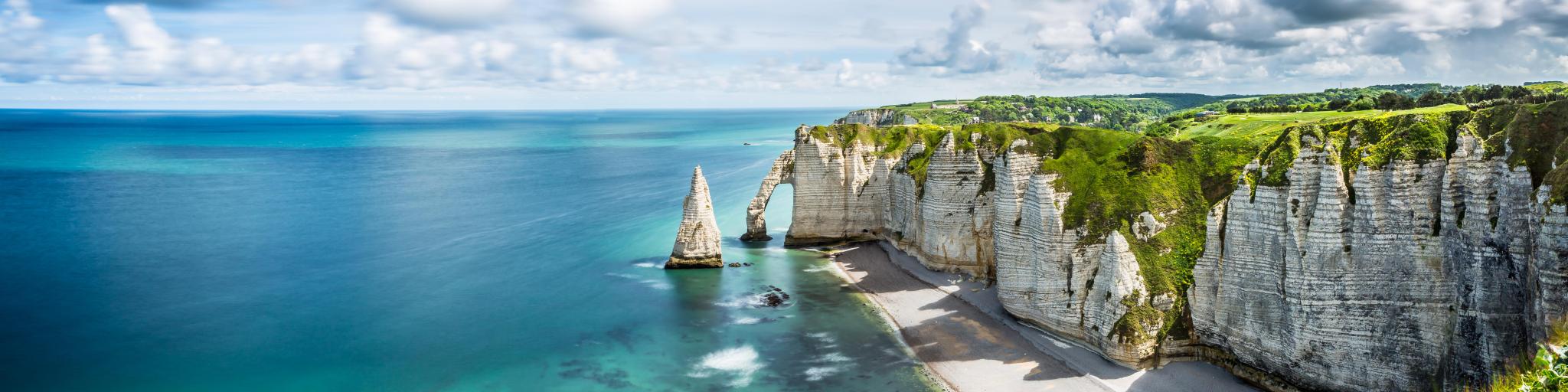 Beautiful Panorama in Etretat France. You can see the sea, beach, coast, Normandy, Atlantic Ocean, cliffs and rock in the photo.