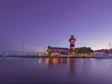 Dusk at downtown Hilton Head Island, with the iconic, historic lighthouse set against a purple sky