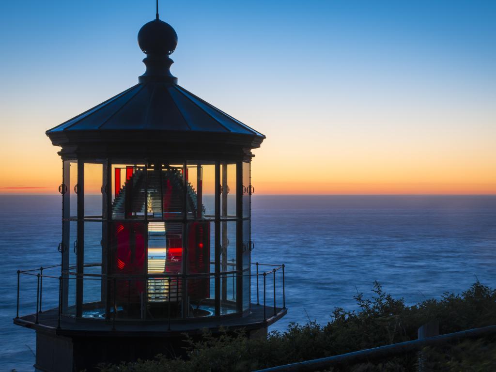 Lighthouse and ocean at sunset