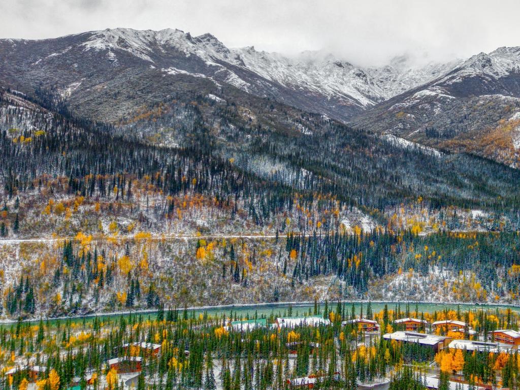 Cool Aerial View of the Resort Area of Healy, Alaska and the River and Snow-Covered Mountains in the Background