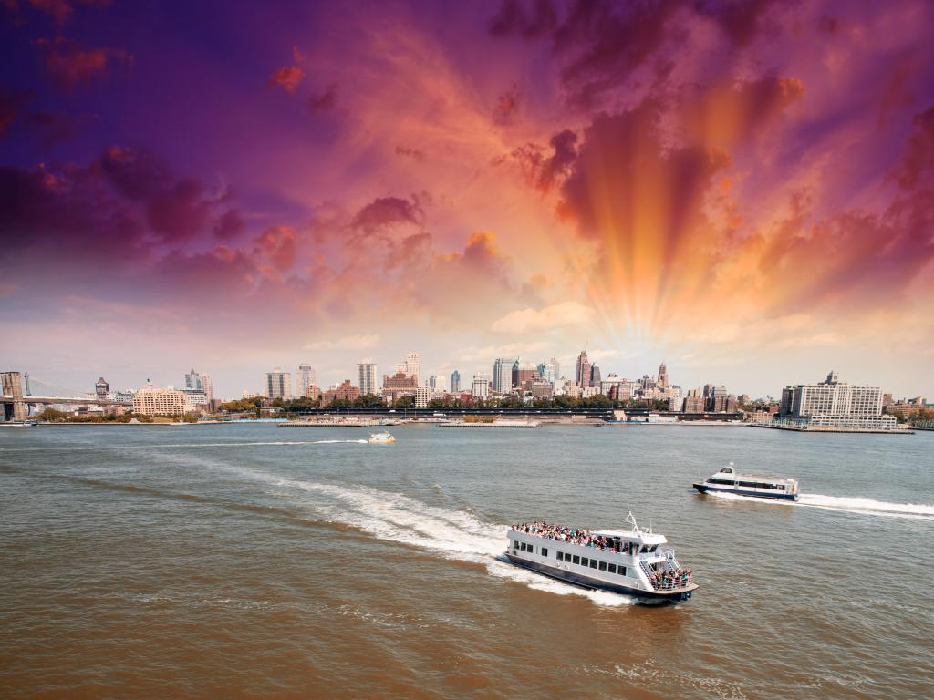 Ferries crossing the river from Manhattan to Brooklyn at sunset